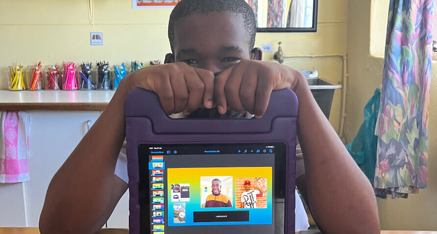 Child showing iPad with video