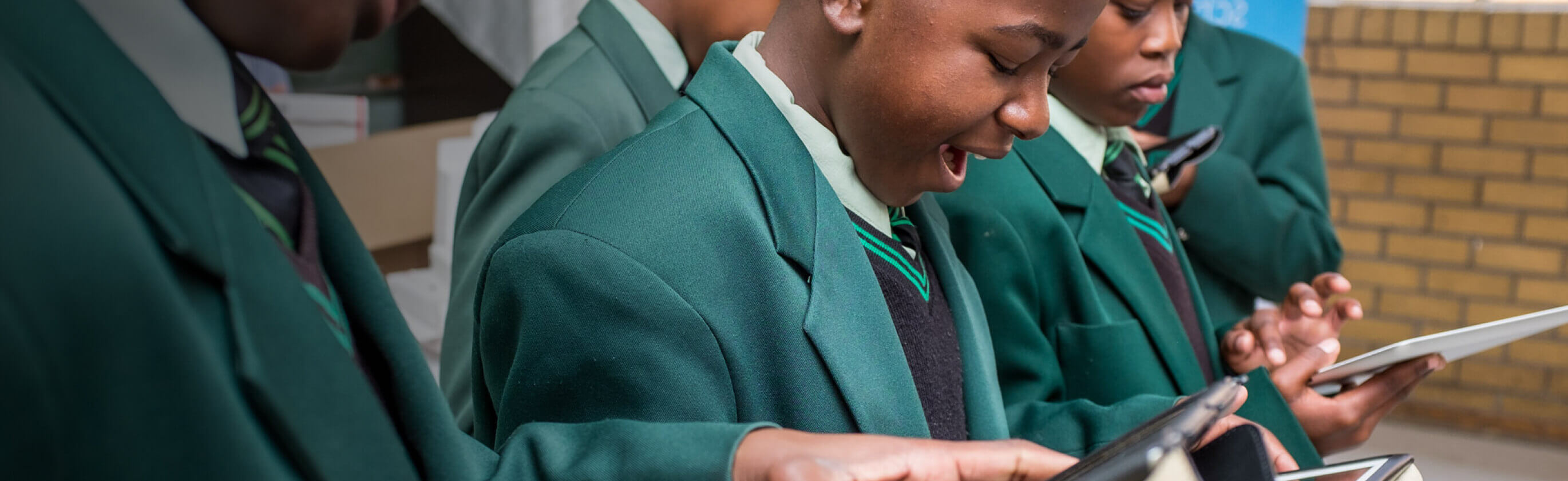 Children learning on an iPad